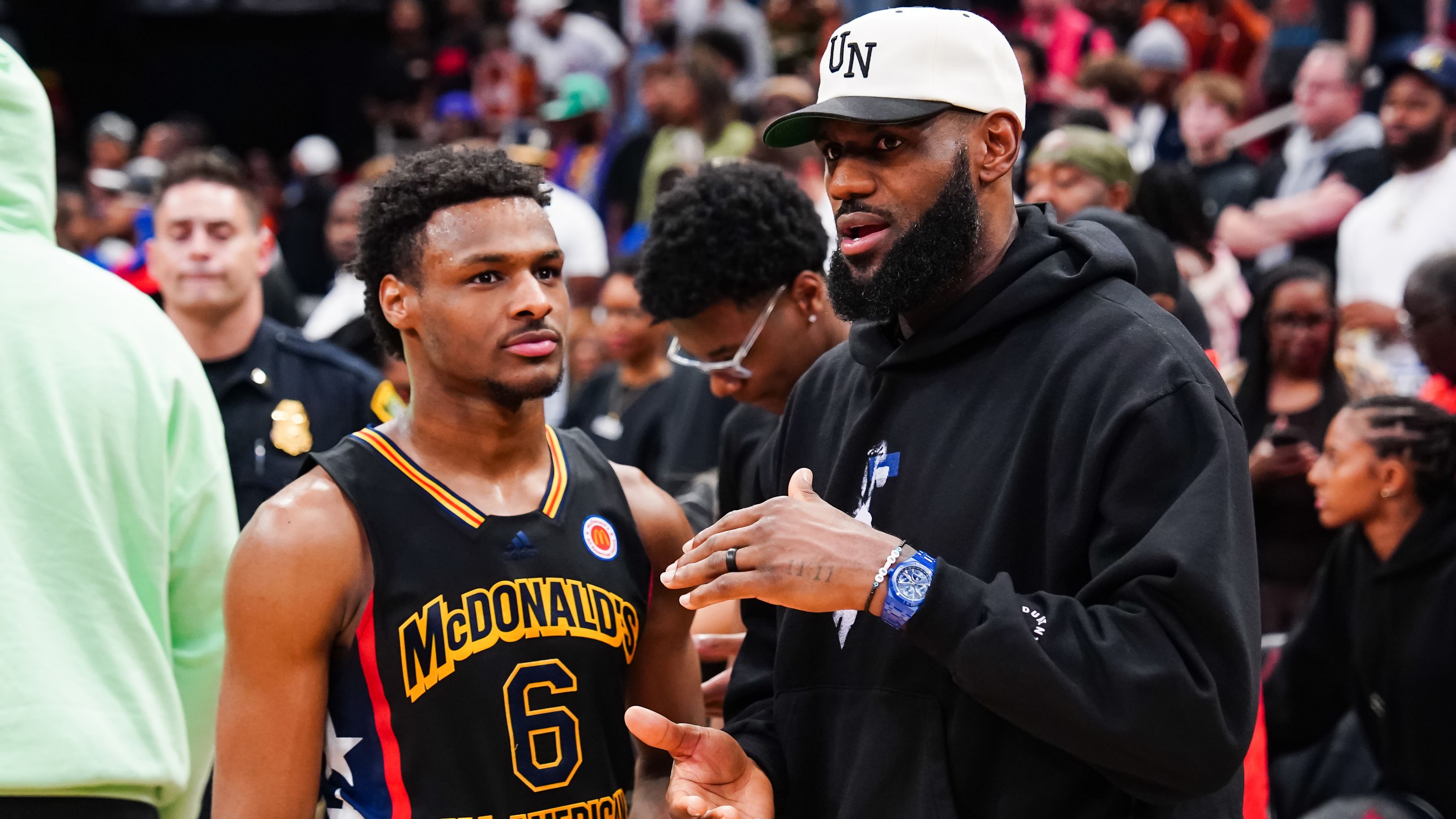 HOUSTON, TEXAS - MARCH 28: Bronny James #6 of the West team talks to Lebron James of the Los Angeles Lakers after the 2023 McDonald&#x27;s High School Boys All-American Game at Toyota Center on March 28, 2023 in Houston, Texas. (Photo by Alex Bierens de Haan/Getty Images)