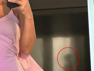 Kim Kardashian selfie mysterious figure