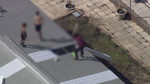 A group of young detainees have climbed to the roof of a building of a detention centre in Perth.