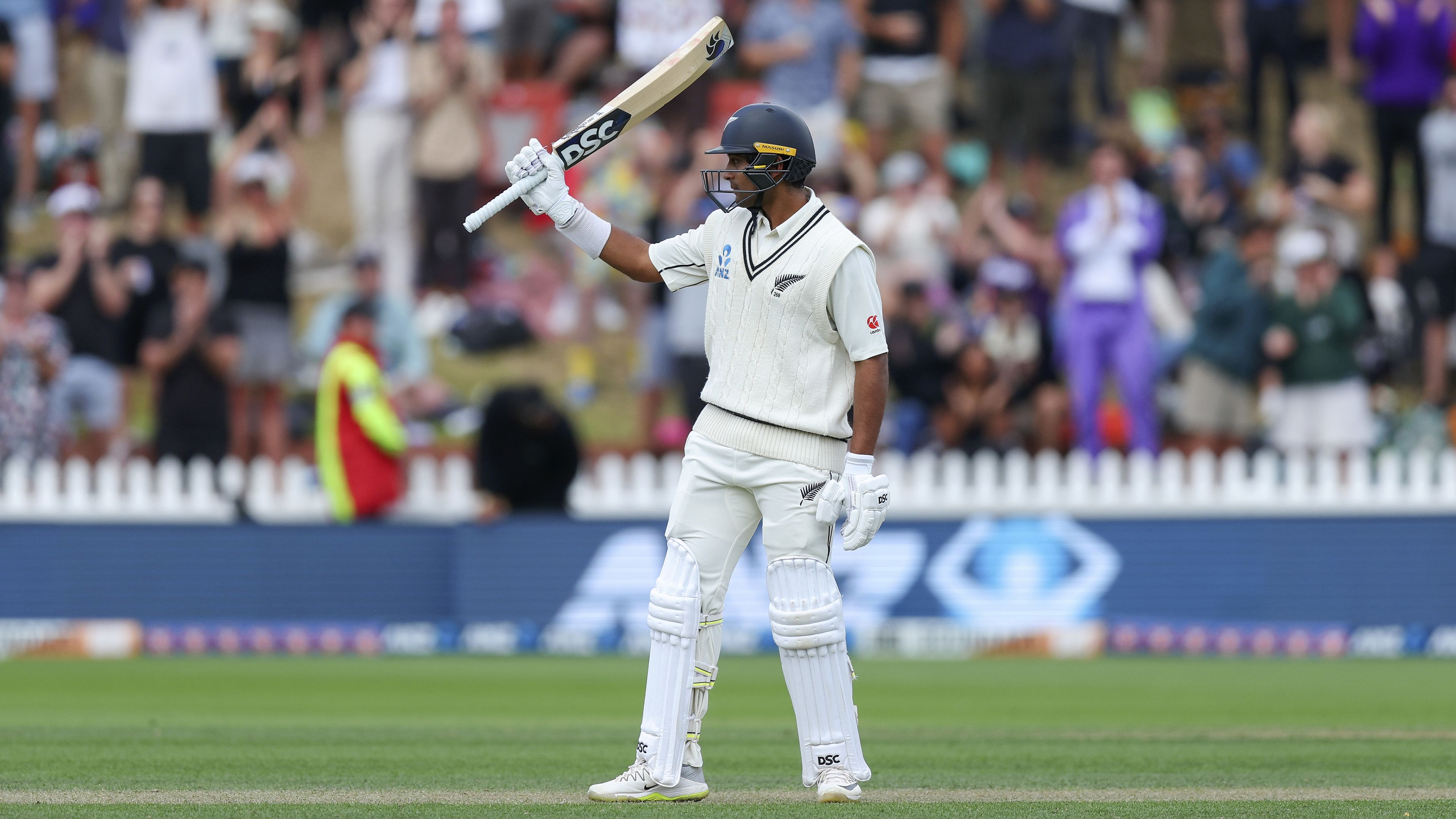 Rachin Ravindra celebrates his half-century during day three of the first Test between Australia and New Zealand.