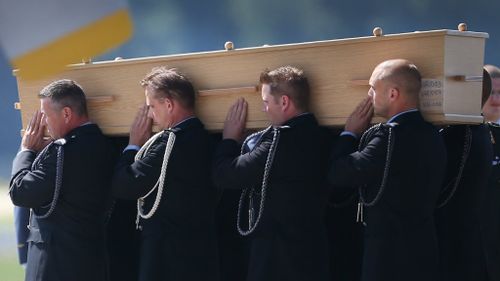 Each coffin, containing unidentified remains from the crash, has been numbered. (Getty Images)