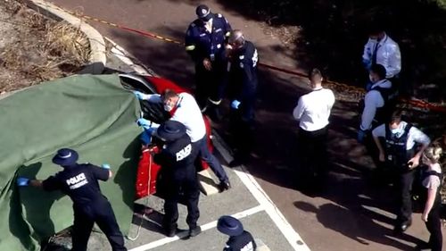 Firefighters have found three bodies inside a burnt out vehicle at a car park in Perth.