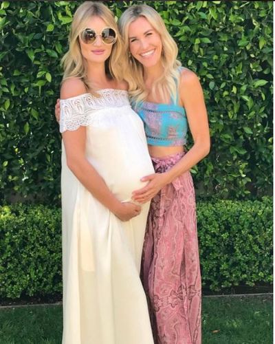 <p>Rosie Huntington-Whiteley has celebrated the upcoming arrival of her first baby at a baby shower to which she wore a white wedding dress that showcased her bump beautifully.</p>
<p>The model mama-to-be teamed the <a href="https://www.net-a-porter.com/au/en/product/677978?cm_mmc=GoogleProductSearchPLA-_-AU-_-Dresses-Clothing-Self-Portrait-Google&amp;cm_mmc=Google-ProductSearch-AU--c-_-Net-a-Porter-AUPLA-_-AUS+-+GS+-+Designers+-+Low--Core+Designers-_-__pla-120269865875_APAC&amp;gclid=CMK95dWTh9QCFdYEKgodAZkBnQ" target="_blank">Bardot guipere lace-trimmed maxi dress by Self-Portrait</a>, with over-sized sunglasses and just a hint a soft pink lip gloss and she looked absolutely stunning.</p>
<p>It may be a cliche but these sweet snaps of Rosie, who is expecting her first child with fiance actor Jason Statham, show that she's truly glowing. If only we'd looked like this at nine months ... For more details of the baby shower and Rosie herself, click through.&nbsp;</p>