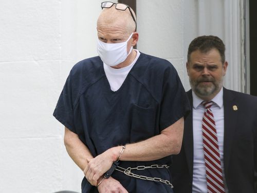 Alex Murdaugh is escorted out of the Colleton County Courthouse in Walterboro, SC, on July 20, 2022. 