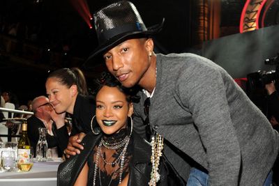Even the happiest singer in the world Pharrell, looks concerned with Rihanna's iHeartRadio get-up.