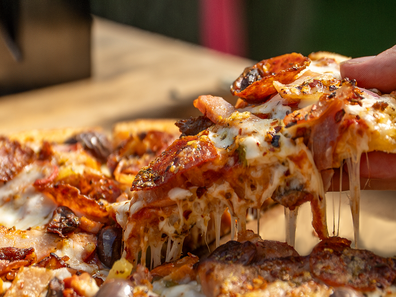 Domino's announces 50 per cent off pizzas.
