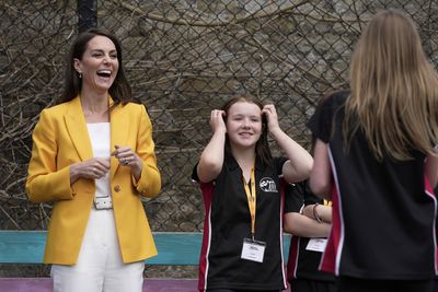 Britain's Kate, Princess of Wales, smiles as she visits the Dame Kelly Holmes Trust 