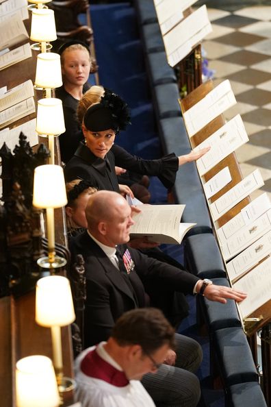 Mia Tindall (top), Zara Tindall (centre) and Mike Tindall (second bottom) attend the Committal Service for Queen Elizabeth II held at St George's Chapel  on September 19, 2022 in Windsor, England. 