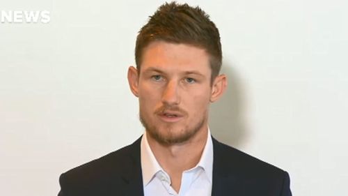 A dismayed Cameron Bancroft faces the press after flying into Perth from South Africa. Picture: 9News