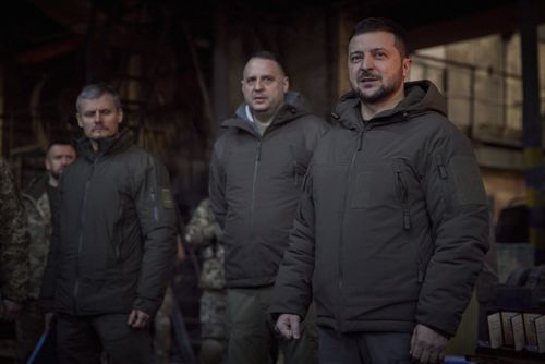 Ukrainian President Volodymyr Zelenskyy, right, speaks to soldiers at the site of the heaviest battles with the Russian invaders in Bakhmut, Ukraine, Tuesday, Dec. 20, 2022.