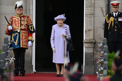 Queen Elizabeth II (C) attends an Armed Forces Act of Loyalty Parade at the Palace of Holyroodhouse on June 28, 2022 in Edinburgh, United Kingdom.