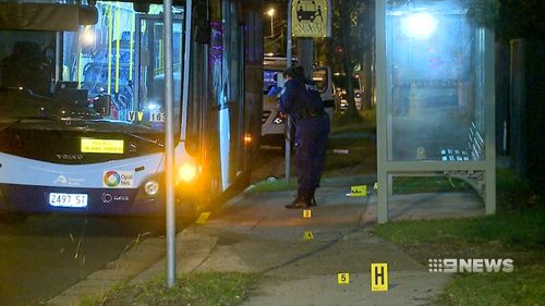 A 22-year-old was arrested and another is on the run after an assault at a Sydney bus stop.