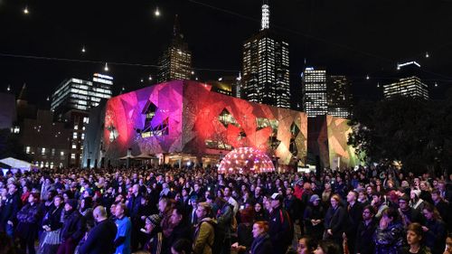 More than a thousand people attended the vigil at Federation Square in Melbourne's CBD. (AAP)
