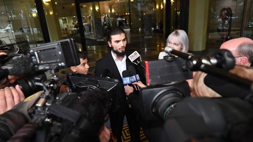 Moudasser Taleb speaks to the media outside Downing Centre Court in Sydney.