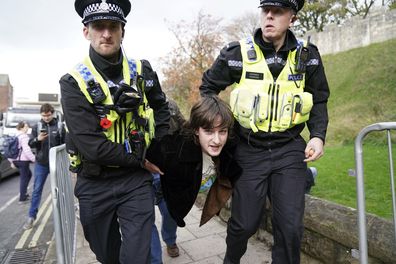 Police detain a protester after he appeared to throw eggs at King Charles III and the Queen Consort as they arrived for a ceremony at Micklegate Bar, where the Sovereign is traditionally welcomed to the city, in York, England, Wednesday November 9, 2022.