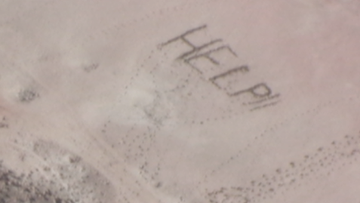Three stranded teenagers have been rescued after their &quot;help&quot; sign written in sand was spotted pilots flying over Western Australia.