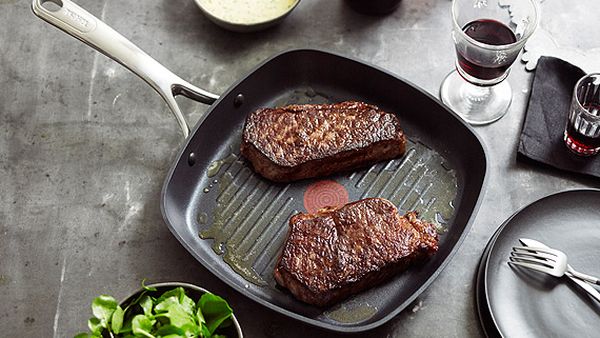 Grilled sirloin steak with b&#233;arnaise sauce and watercress