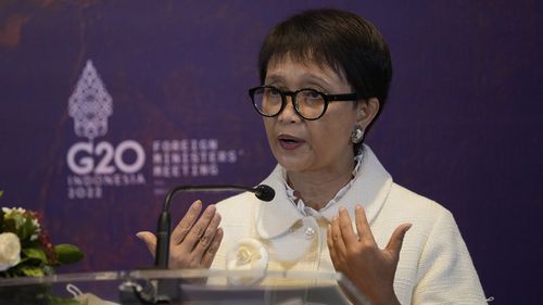 Indonesian Foreign Minister Retno Marsudi gestures as she delivers her press statement after the closing of the G20 Foreign Ministers' Meeting in Nusa Dua, Bali, Indonesia, Friday, July 8, 2022. (AP Photo/Dita Alangkara, Pool)