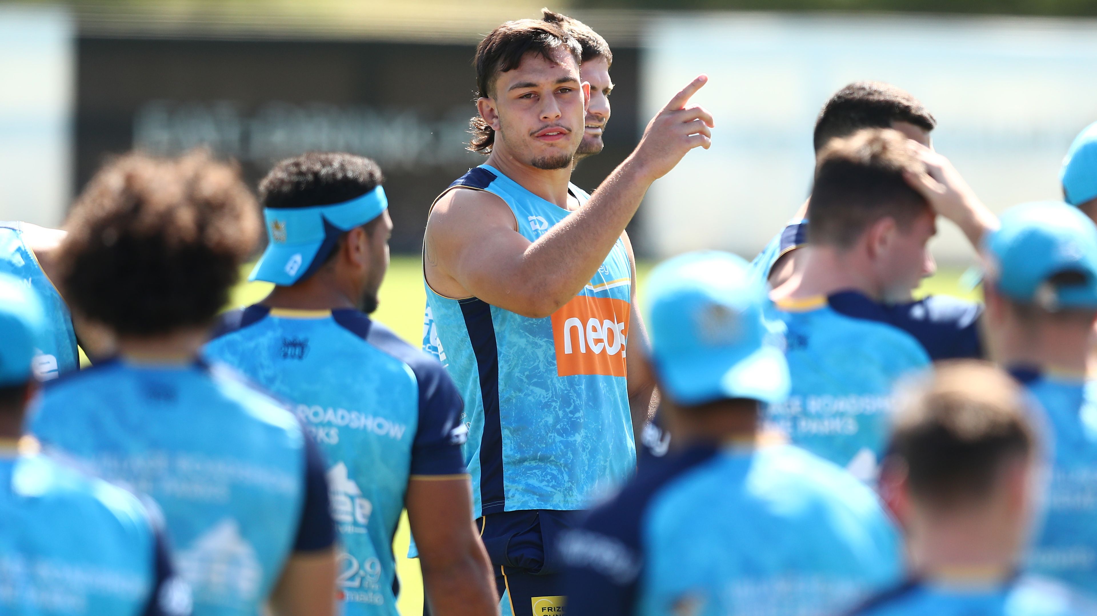 Tino Fa&#x27;asuamaleaui amoungst the playing group during a Gold Coast Titans NRL training session.