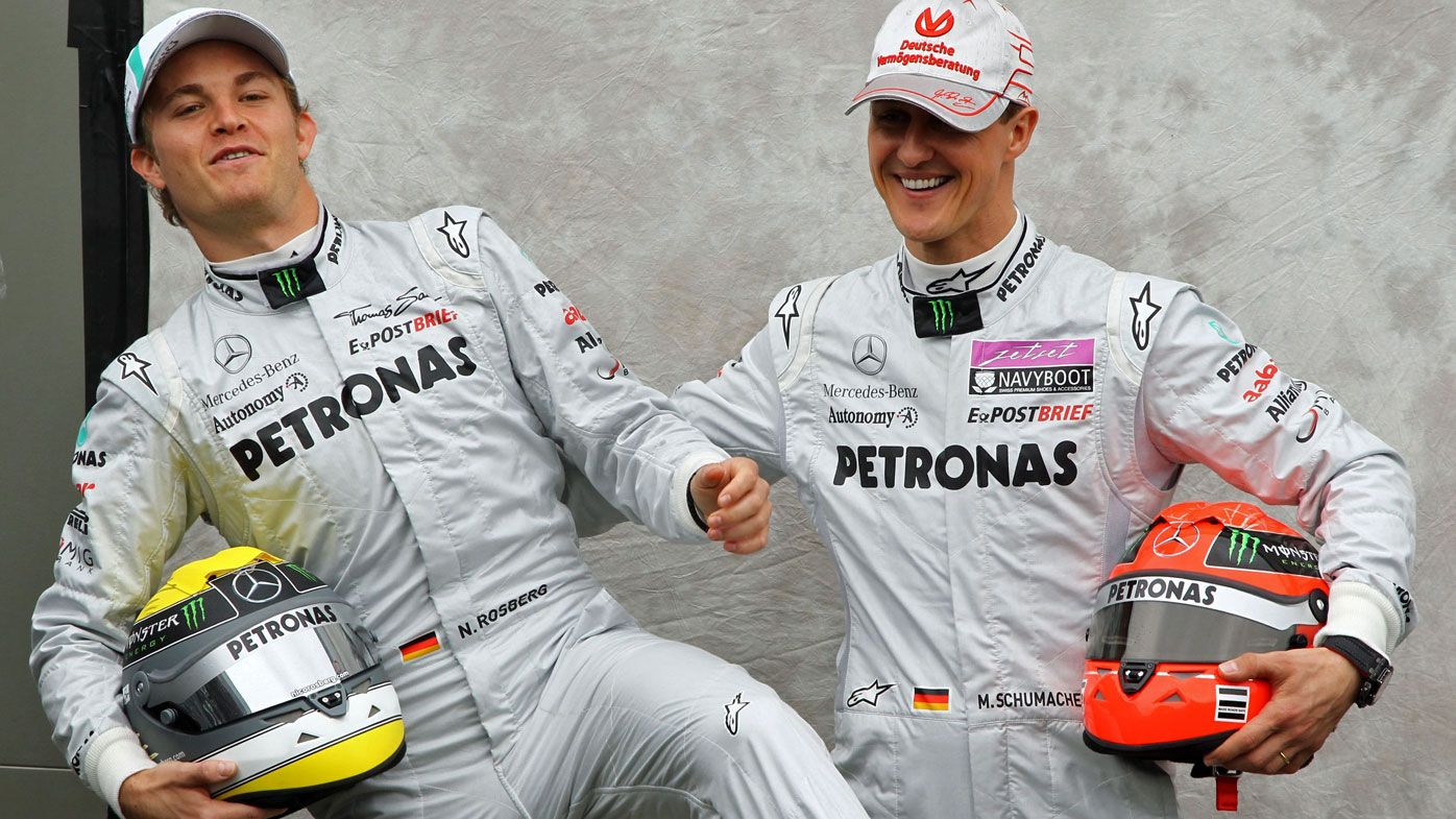 German Formula One driver Michael Schumacher (R) and his teammate Nico Rosberg of Mercedes 