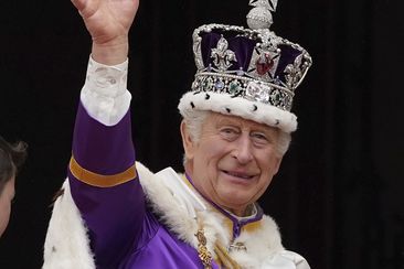 King Charles III waves from the balcony of Buckingham Palace, London, after the coronation ceremony of King Charles III and Queen Camilla, Saturday, May 6, 2023.