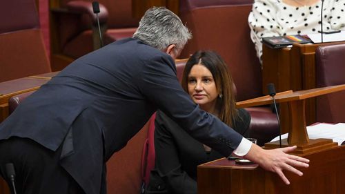 Jacqui Lambie speaks in the Senate with Mathias Cormann.