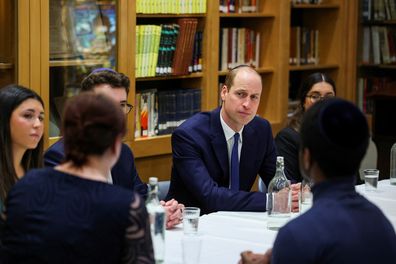 Prince William, Prince of Wales sits with young people, affected by anti-Semitism, together with Holocaust Educational Trust ambassadors during a visit to the Western Marble Arch Synagogue on February 29, 2024 in London