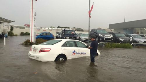 A car semi-submerged near a car dealersip in Port Lincoln. (Facebook/Amy Foureur)