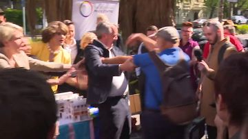 Equality Minister pushed and shoved by angry protester 