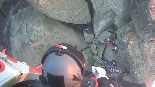 The woman, in her 40s, was at Mount Buffalo in Victoria's High Country when her gear failed, sending her plunging around two storeys on to a rock ledge.
