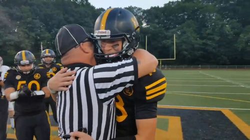 Master Sergeant Joe Egersheim surprised son Cole after appearing at his football game dressed as a referee. (Twitter/@mikemadera2)