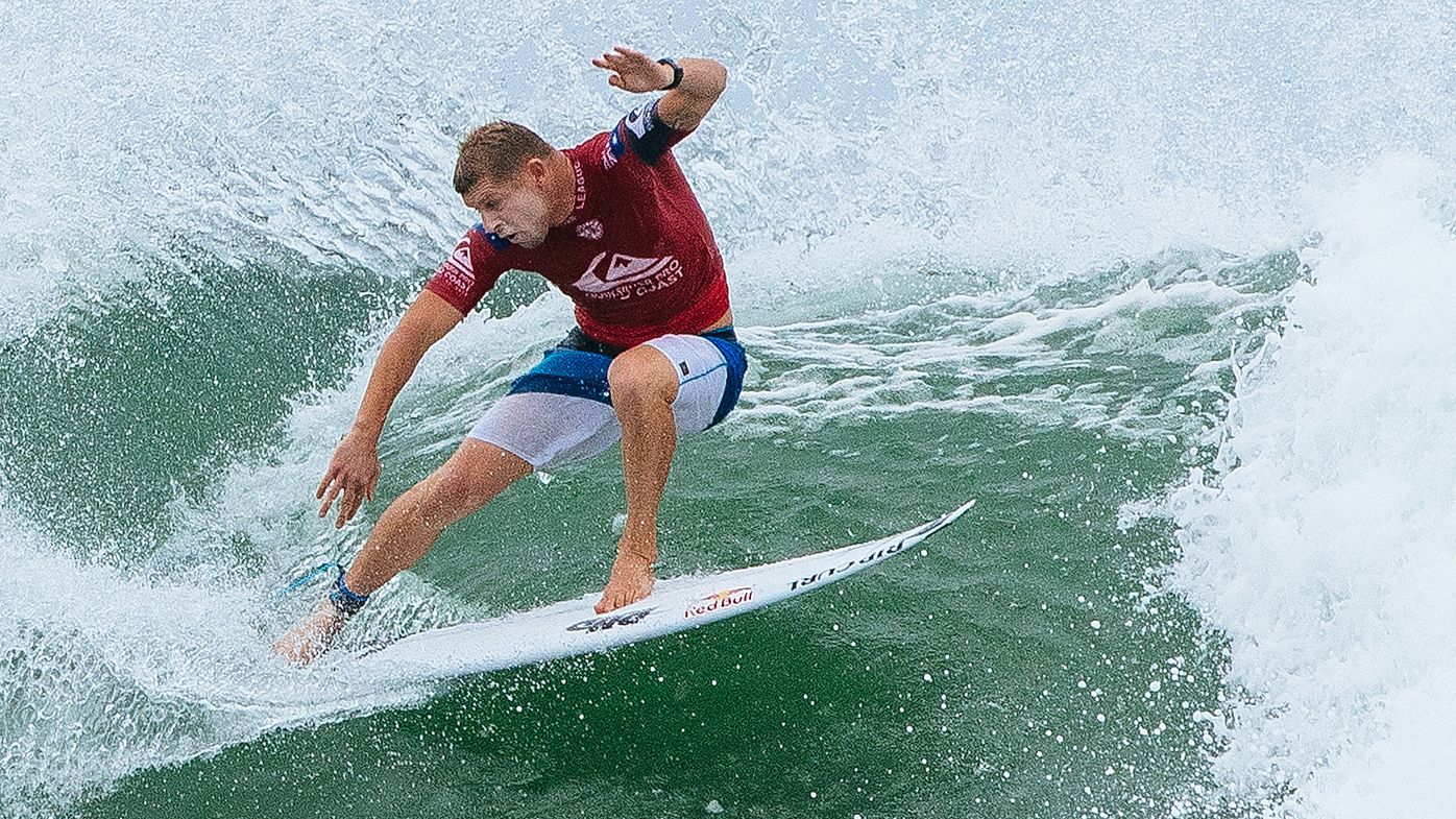 Wilson defies pain in Quik Pro surf final