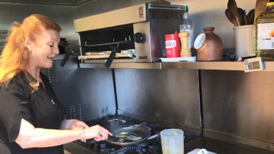 The Duchess is shown using her home's second kitchen.