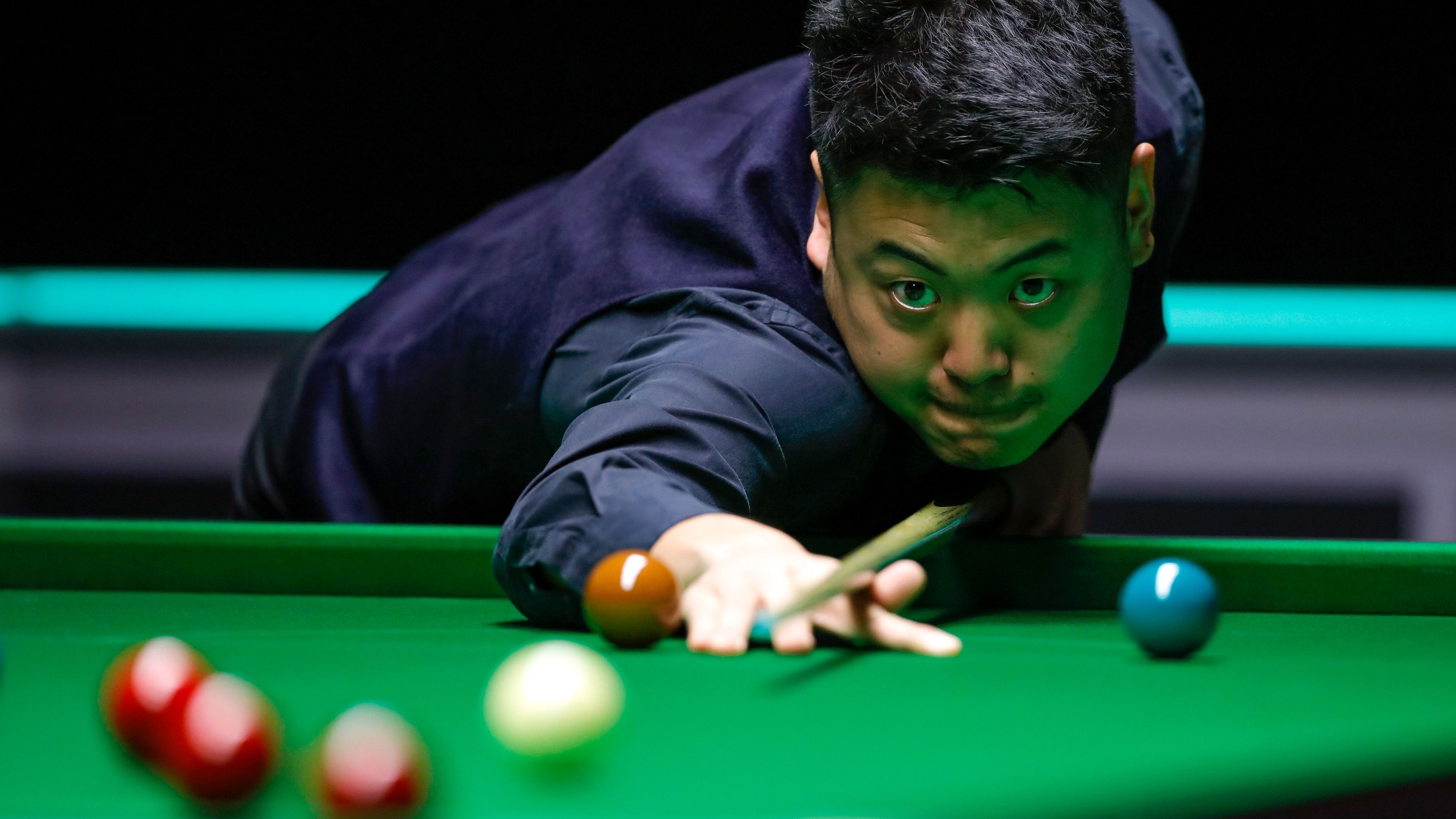 Liang Wenbo of China competes during the Snooker UK Championship 2019 first round match with Dominic Dale of Wales in York, Britain on Nov. 26, 2019. (Photo by Xinhua/Han Yan via Getty)