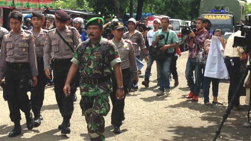 There is a heavy police presence in the Indonesian port of Cilacap. (9NEWS)