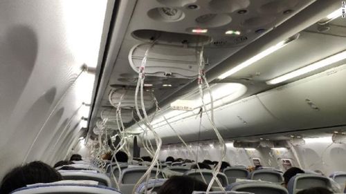 Passengers were required to wear oxygen masks after a loss of cabin pressure caused the plane to drop in the sky. Picture: CNN
