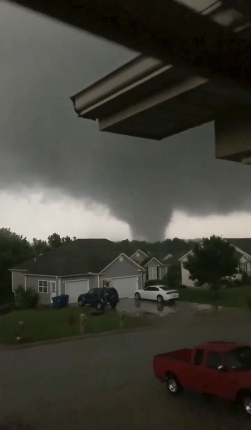 This still image taken from video provided by Chris Higgins shows a tornado, Wednesday, May 22, 2019, in Carl Junction, Mo. The tornado caused some damage in the town of Carl Junction, about six kilometres north of the Joplin airport. (Chris Higgins via AP)