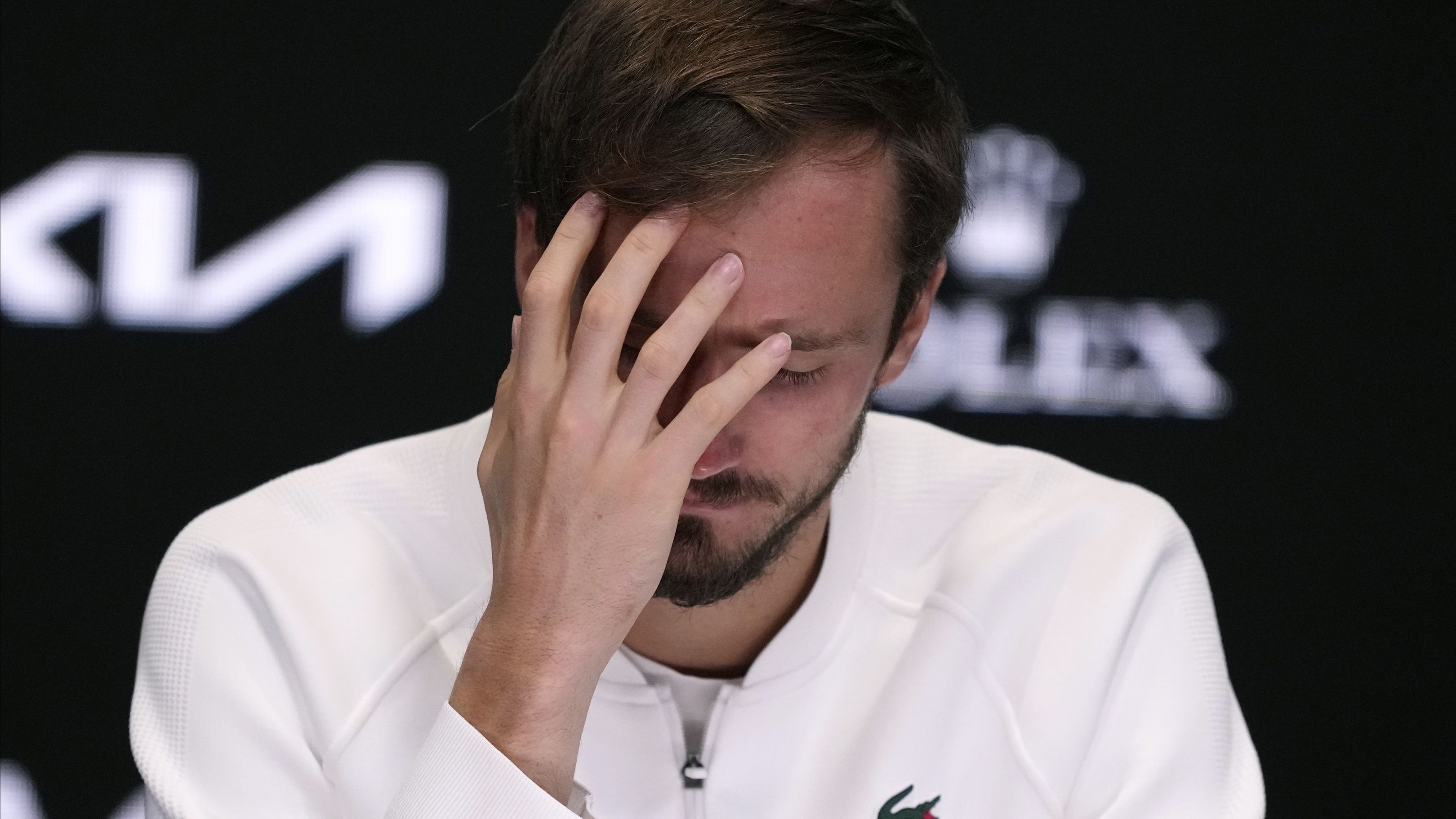 Daniil Medvedev winces after losing the Australian Open final to Jannik Sinner in a five-set thriller.