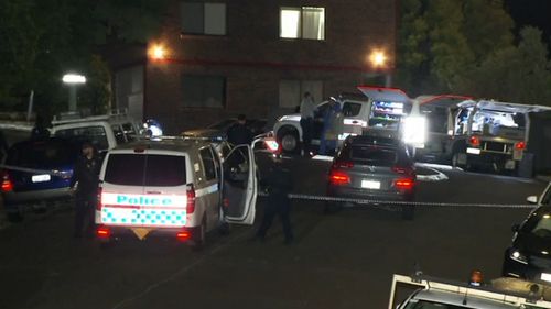 Police outside the Brisbane unit.