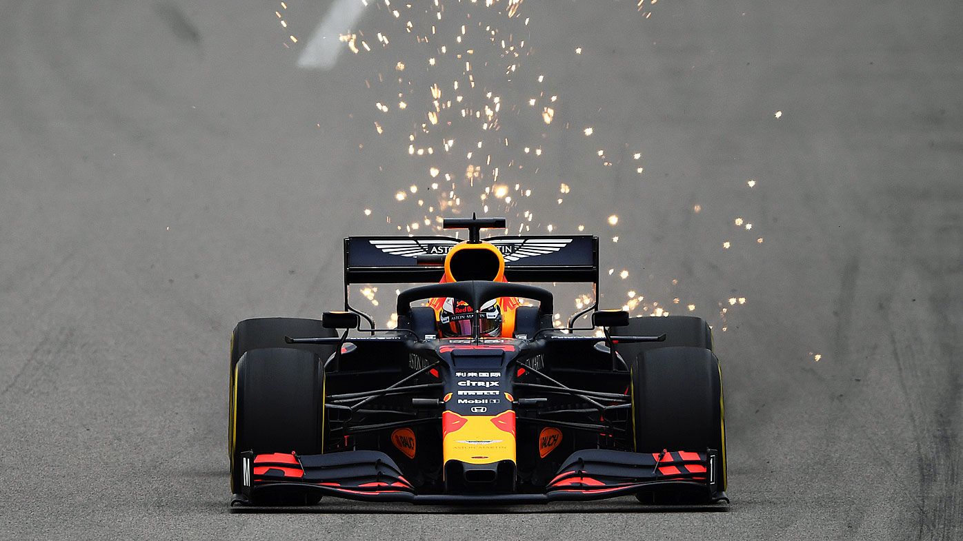 Sparks fly behind Verstappen's car
