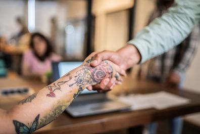 tattoo interview handshake