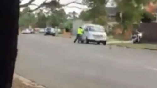 The motorbike rider appears to smash the window of the van. Picture: 9News