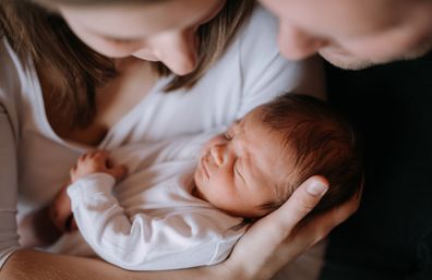 Man and woman with new baby