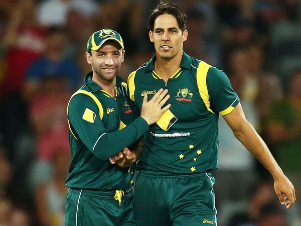 Phil Hughes and Mitchell Johnson. (Getty)