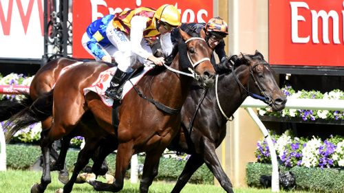 Preferment hits the line ahead of Bondeiger to win the Victoria Derby. (AAP)