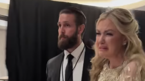 Kirk was seen being escorted out of the event.