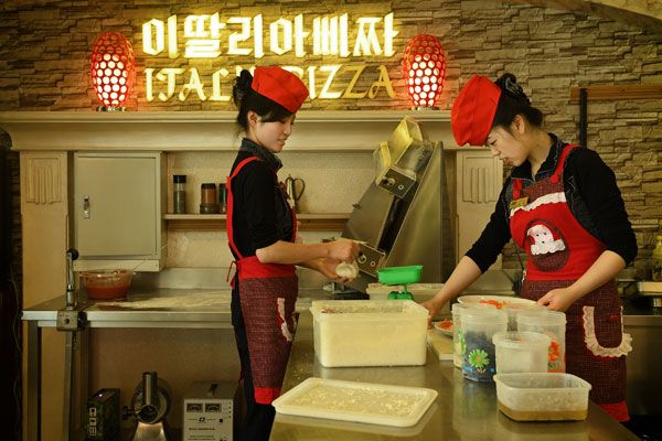 North Korean workers making pizza in up-scale pizza restaurant (Getty Images)