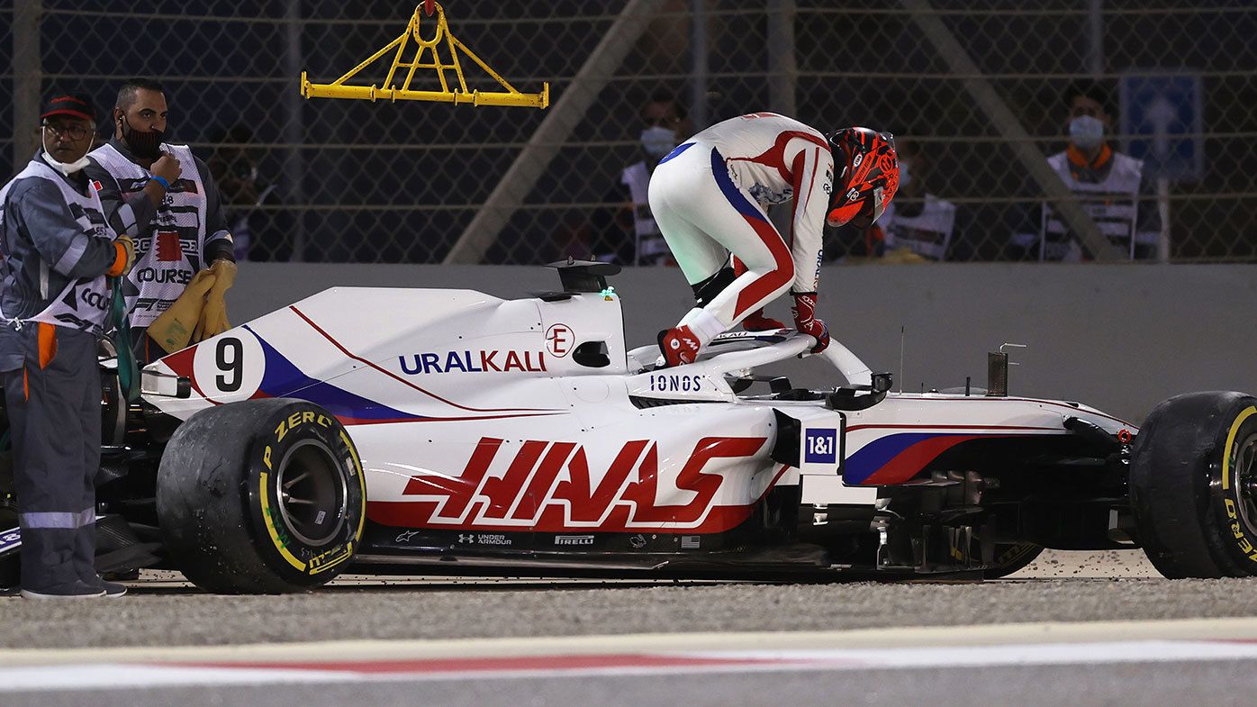 Nikita Mazepin climbs out of his wrecked Haas on the opening lap of the Bahrain Grand Prix.