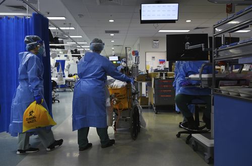 Patients in hospital with coronavirus are younger and sicker with the Delta strain. Pictured: Staff at St Vincent's Hospital ICU.