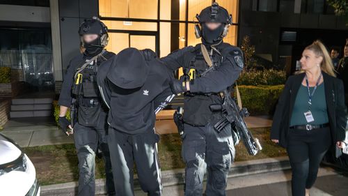 Two men have been charged with murder over the drive-by shooting death of grandmother Kim Duncan in Sydney's south-west.